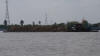 Fully Loaded Barge Travelling Down  The Mekong River, Vietnam